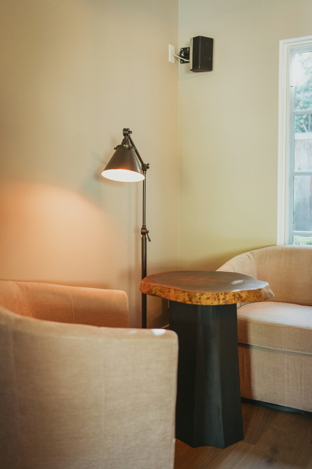 Cozy reading nook with armchair, lamp and open book
