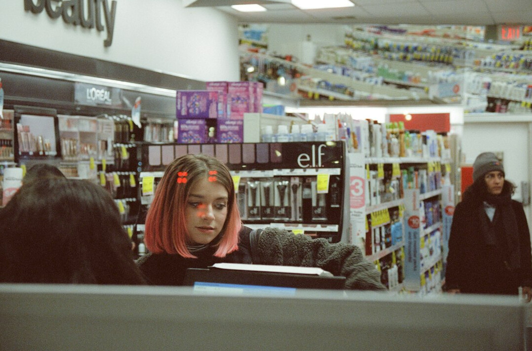 store detective observing shoppers