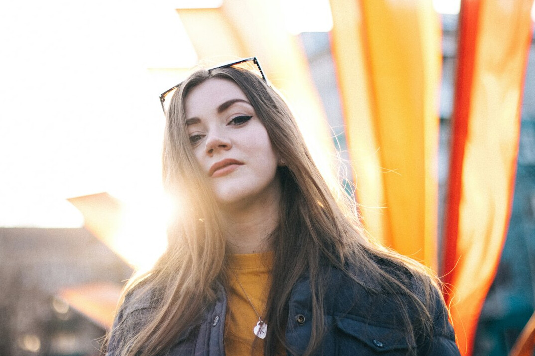 Uruguayan female journalist in her late 20s wearing business casual clothing