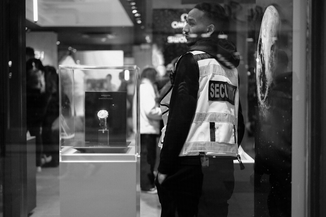 store detective observing customers
